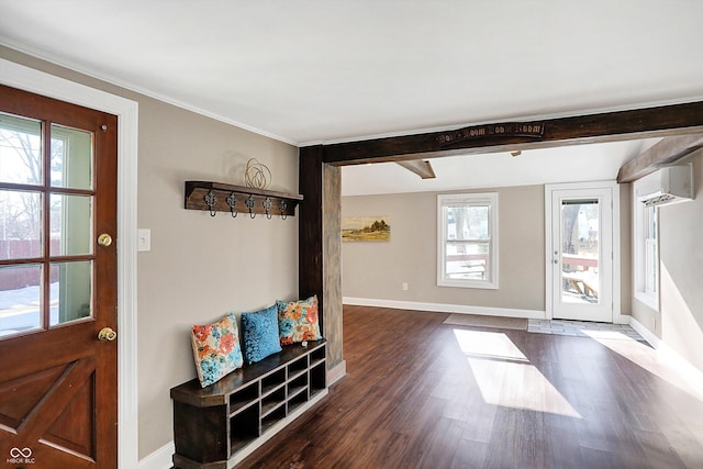 interior space with a wall mounted air conditioner and dark wood-type flooring