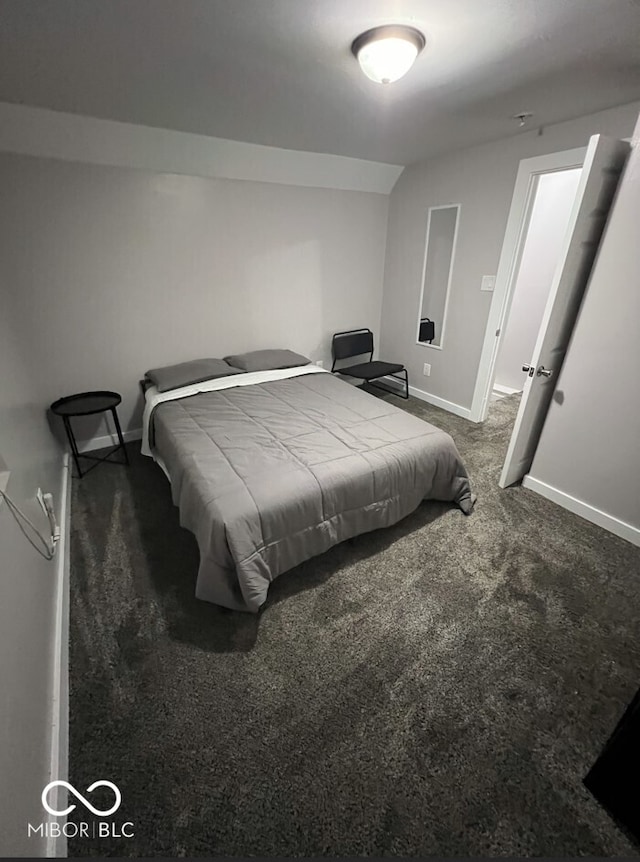 bedroom with dark carpet