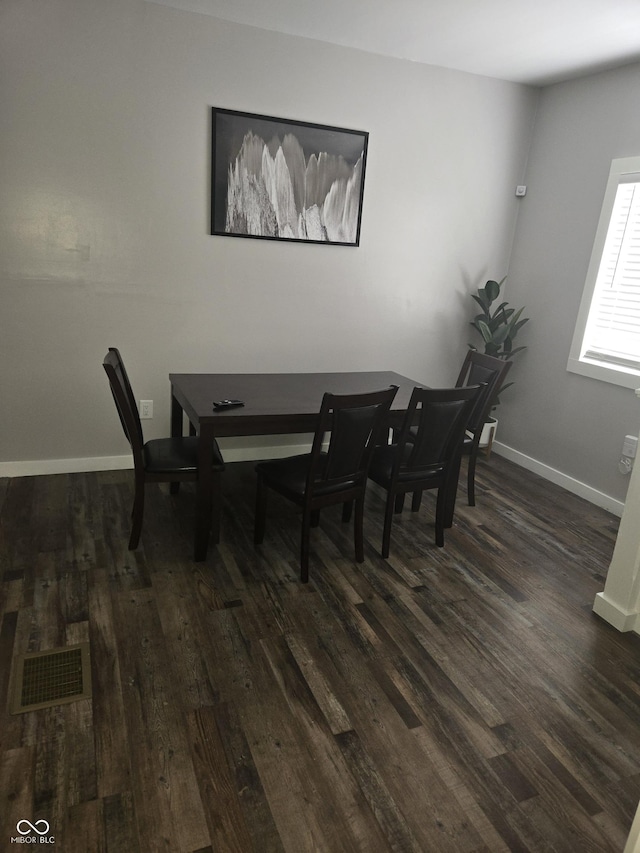 dining room featuring dark hardwood / wood-style flooring