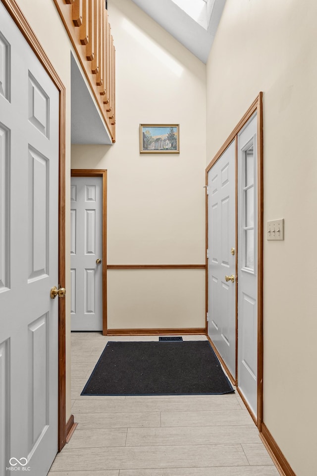 interior space featuring light hardwood / wood-style flooring and lofted ceiling