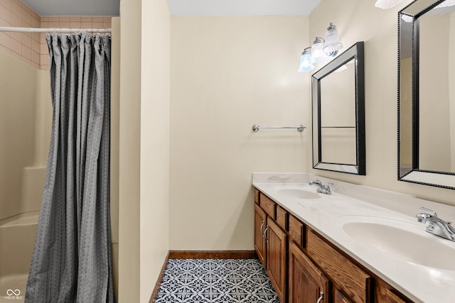 bathroom with tile patterned floors, vanity, and walk in shower