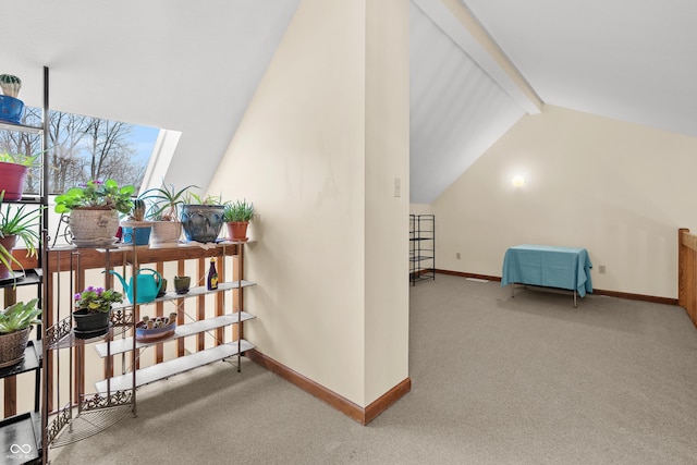 bonus room featuring vaulted ceiling with beams and carpet floors