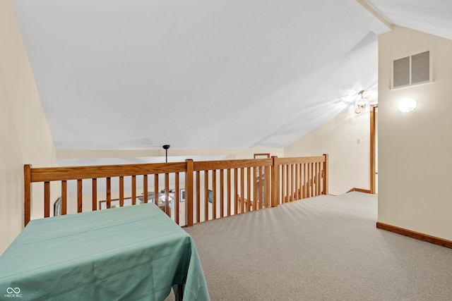 bonus room with carpet and vaulted ceiling