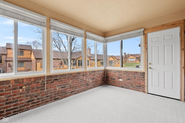 unfurnished sunroom featuring plenty of natural light