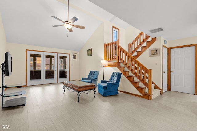 sitting room featuring ceiling fan, high vaulted ceiling, and light hardwood / wood-style flooring