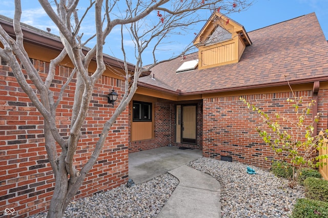 entrance to property featuring a patio area