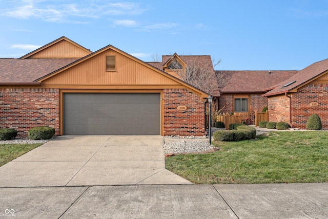 single story home featuring a garage and a front yard