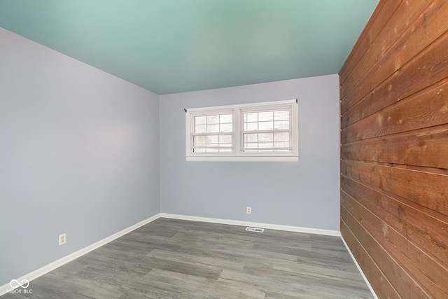 empty room featuring hardwood / wood-style floors