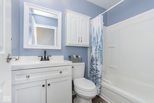 full bathroom featuring toilet, vanity, and shower / tub combo with curtain