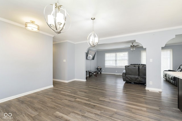 living room featuring ceiling fan with notable chandelier, crown molding, and dark wood-type flooring