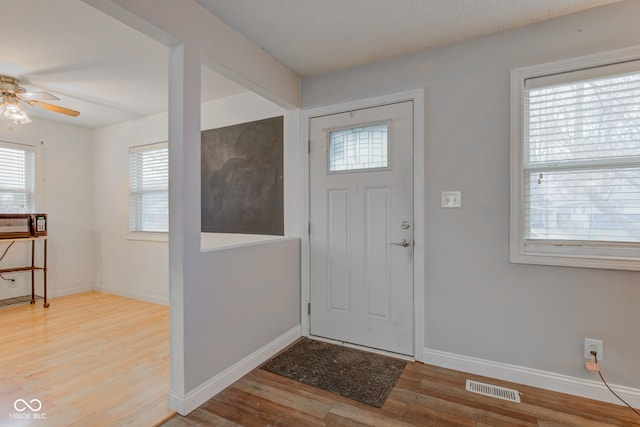 entrance foyer featuring ceiling fan and light wood-type flooring