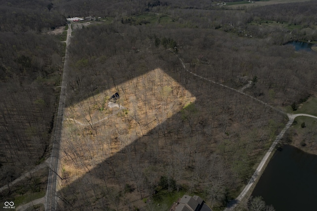 birds eye view of property with a rural view