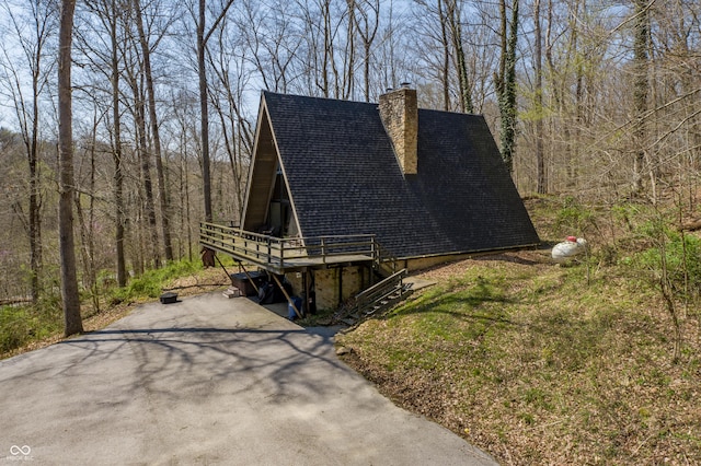 view of front facade with a wooden deck