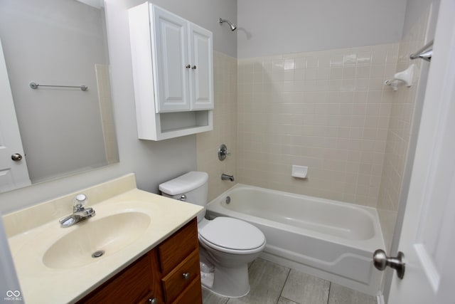 full bathroom with tile patterned flooring, vanity, toilet, and tiled shower / bath