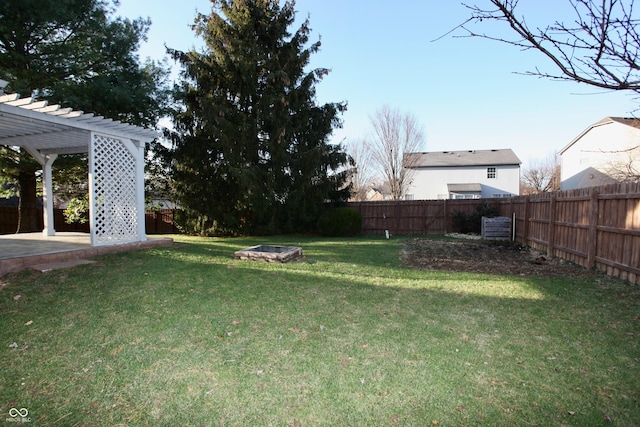 view of yard featuring a fire pit and a pergola