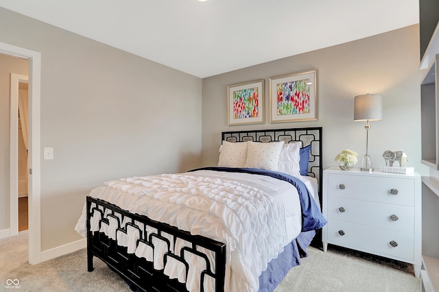 bedroom with light colored carpet