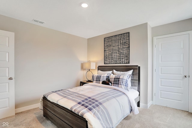 bedroom featuring light carpet