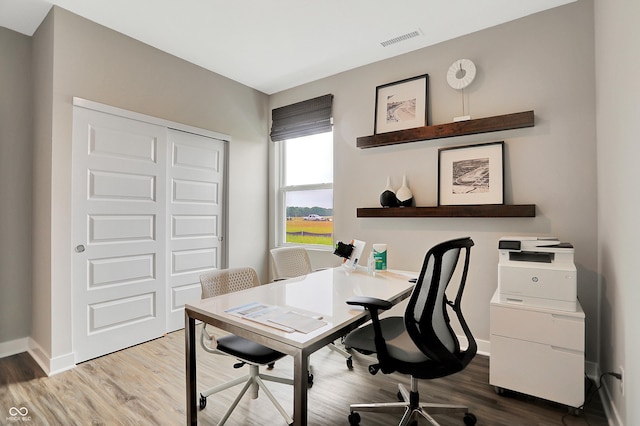 home office with light wood-type flooring