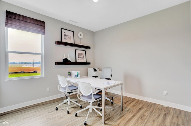 home office with light wood-type flooring