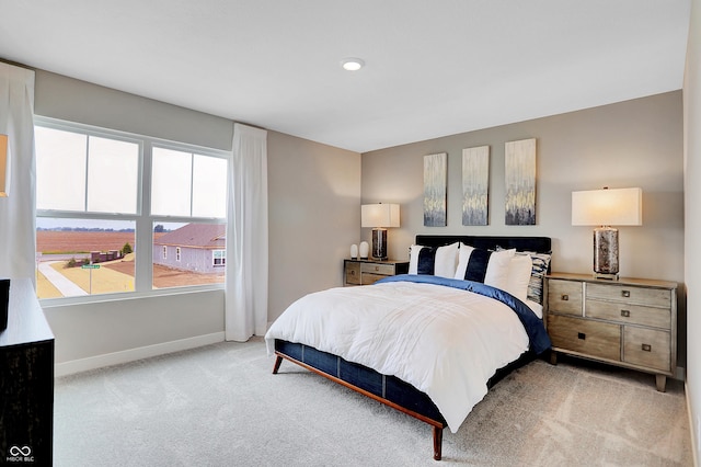 bedroom with light colored carpet