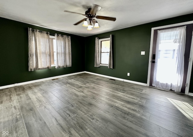 unfurnished room featuring ceiling fan and wood-type flooring