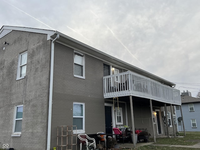 back of property featuring a balcony