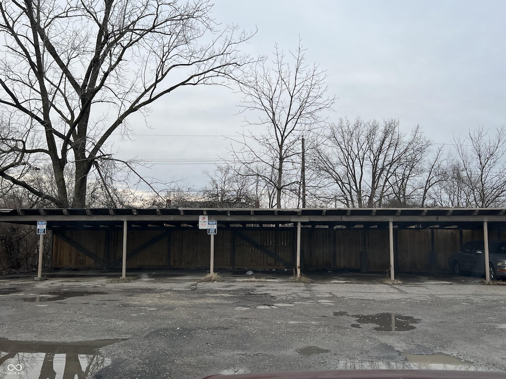 exterior space with a carport