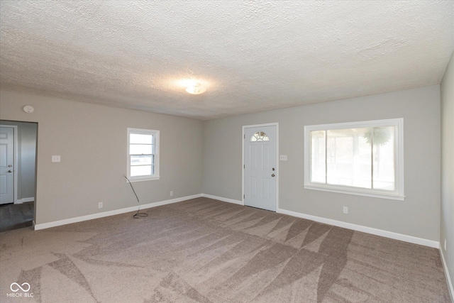 3060 S Shortridge Rd, Indianapolis, IN 46239 - unfurnished living room with carpet flooring and a textured ceiling