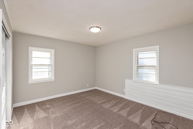 3060 S Shortridge Rd, Indianapolis, IN 46239 - empty room featuring dark colored carpet and healthy amount of natural light