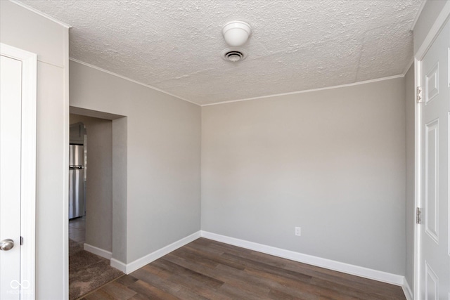 3060 S Shortridge Rd, Indianapolis, IN 46239 - unfurnished room featuring dark wood-type flooring, ornamental molding, and a textured ceiling
