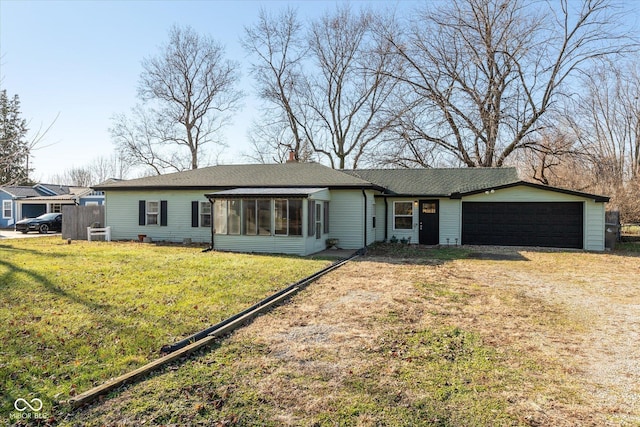 3060 S Shortridge Rd, Indianapolis, IN 46239 - ranch-style home with driveway, a sunroom, an attached garage, a front yard, and a shingled roof
