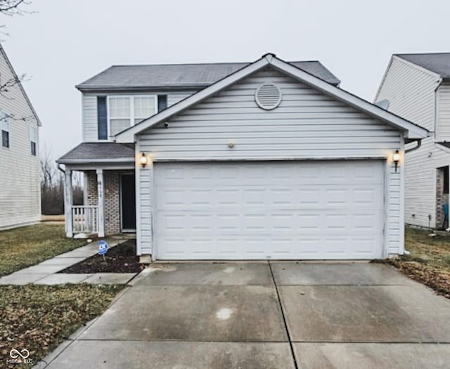 front of property with a porch and a garage