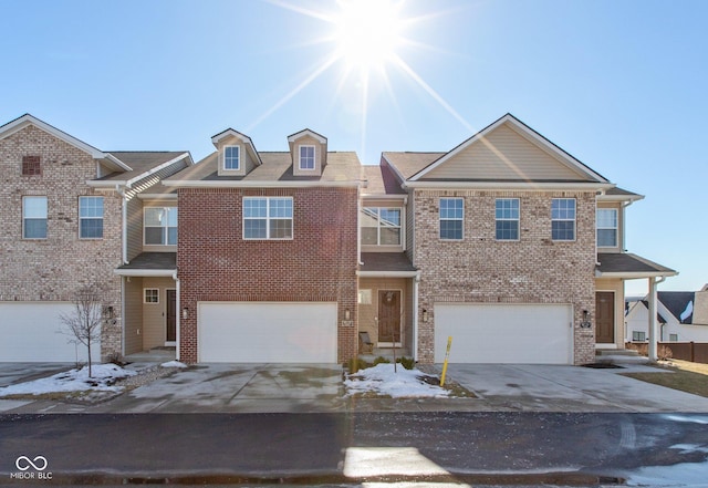 multi unit property featuring a garage