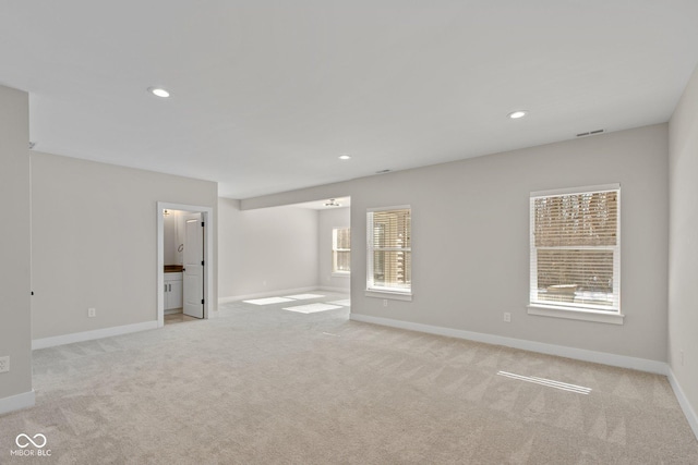 empty room featuring light colored carpet