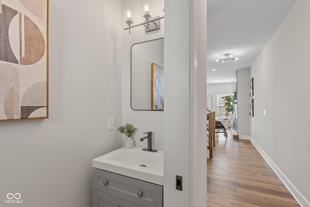 bathroom with vanity and wood-type flooring