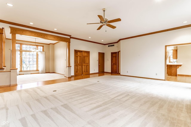 unfurnished living room with light hardwood / wood-style flooring, ceiling fan with notable chandelier, and ornamental molding