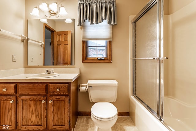 full bathroom featuring tile patterned flooring, vanity, toilet, and shower / bath combination with glass door