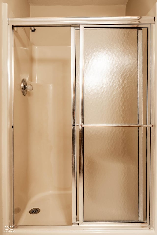 bathroom featuring an enclosed shower