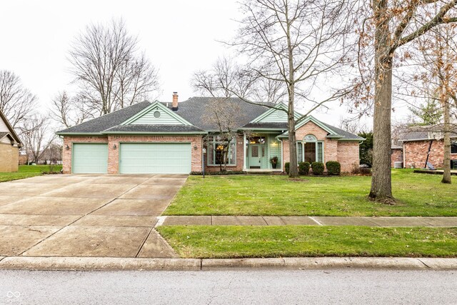 single story home with a front yard and a garage