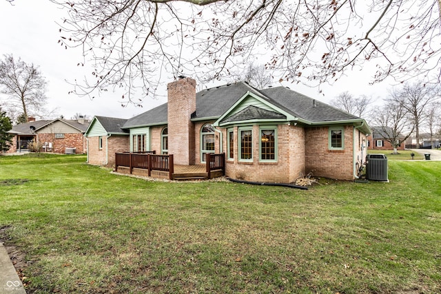 back of property featuring a yard, a deck, and cooling unit