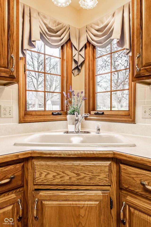 bathroom featuring decorative backsplash and sink