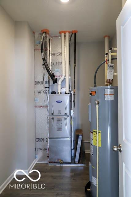 utility room with electric water heater