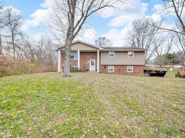 bi-level home with a front lawn