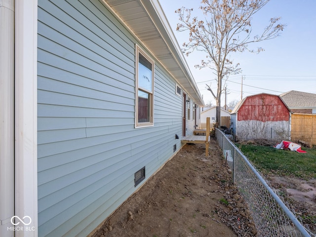 view of property exterior with an outdoor structure