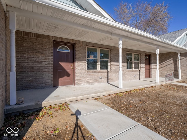 doorway to property with covered porch