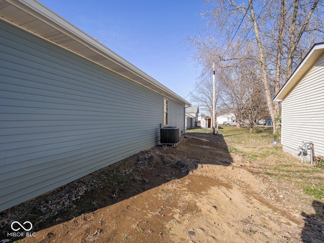 view of property exterior with central AC