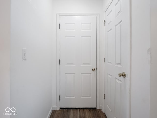 corridor featuring dark hardwood / wood-style flooring