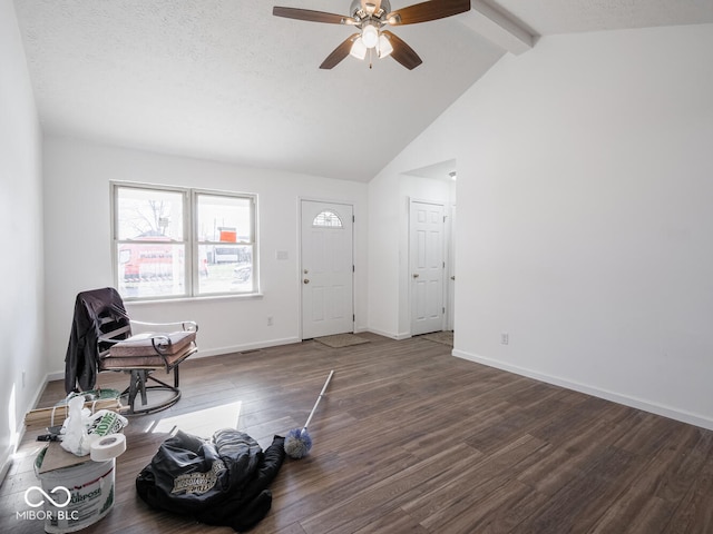 foyer with dark wood-type flooring, high vaulted ceiling, ceiling fan, a textured ceiling, and beamed ceiling