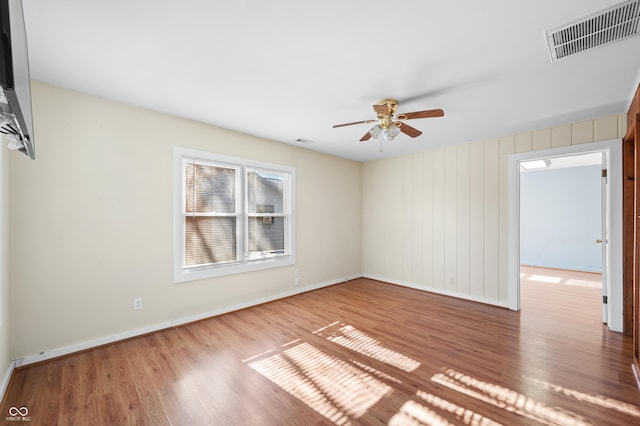 100 N Jefferson St, Nashville, IN 47448 - spare room with wood finished floors and ceiling fan