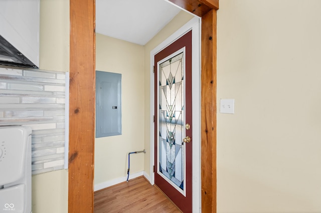 100 N Jefferson St, Nashville, IN 47448 - foyer entrance featuring electric panel, light wood-style floors, and washer / clothes dryer